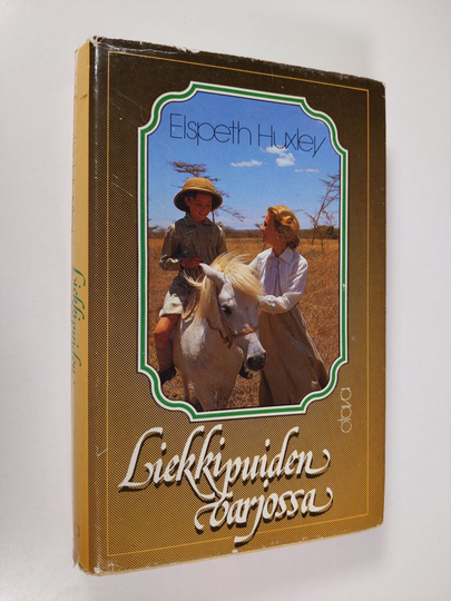 Elspeth Huxley : Liekkipuiden varjossa : muistoja lapsuudesta Afrikassa